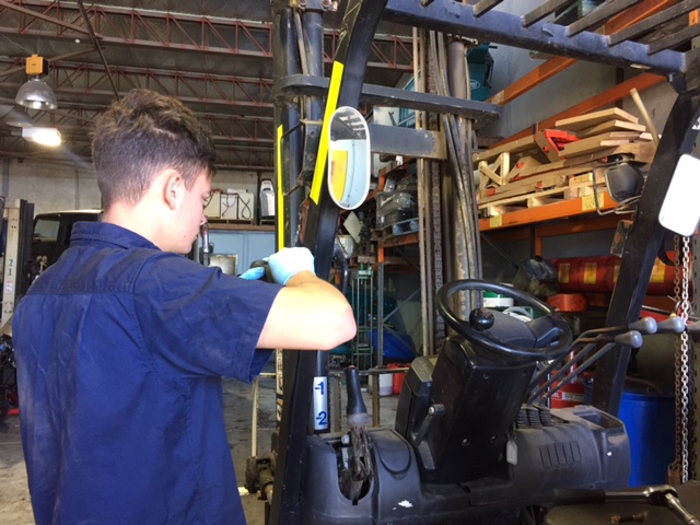 Forklift servicing in workshop